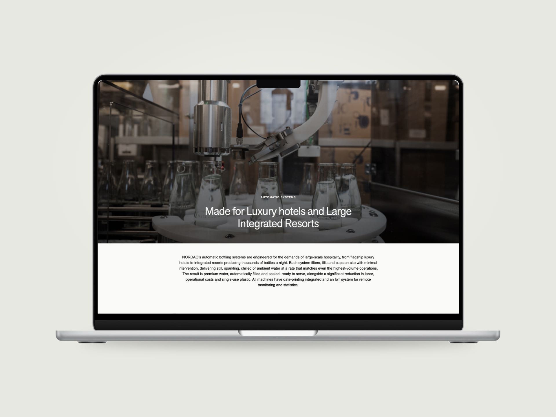 The Nordaq Water Systems page on a MacBook, bottles filling on an automatic carousel