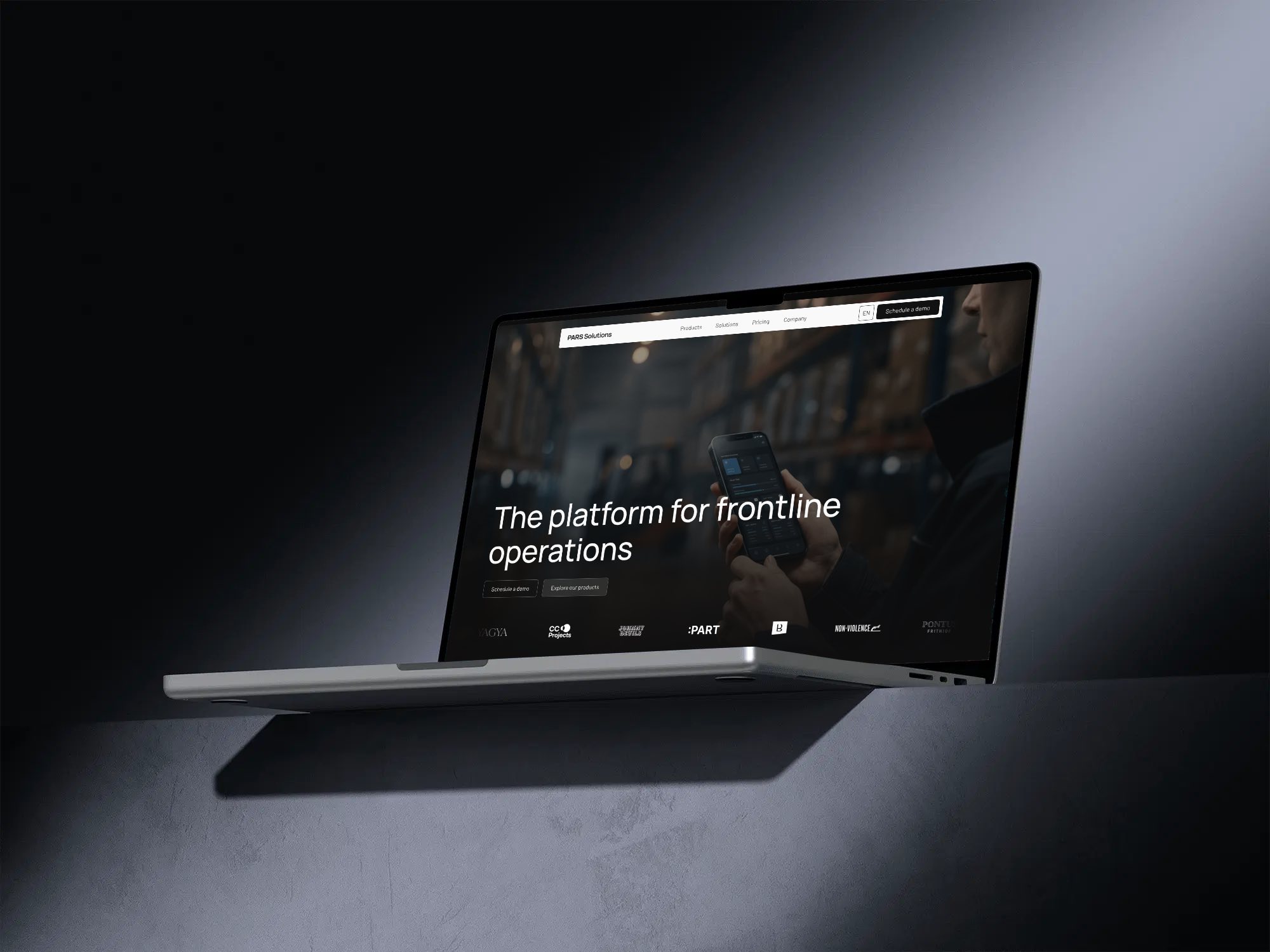 The PARS Solutions home page on a floating MacBook in blue grey light, The platform for frontline operations